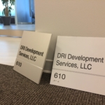 solid aluminum with a V grove cut in the sign with stainless Steel Grade 2 Braille