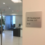 solid aluminum with a V grove cut in the sign with stainless Steel Grade 2 Braille